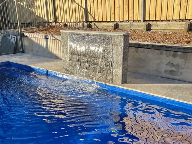 pool surrounds, travertine coping, natural stone for swimming pools, granite pavers, limestone pavers, stone pavers, pool concreting, swimming pool tiling