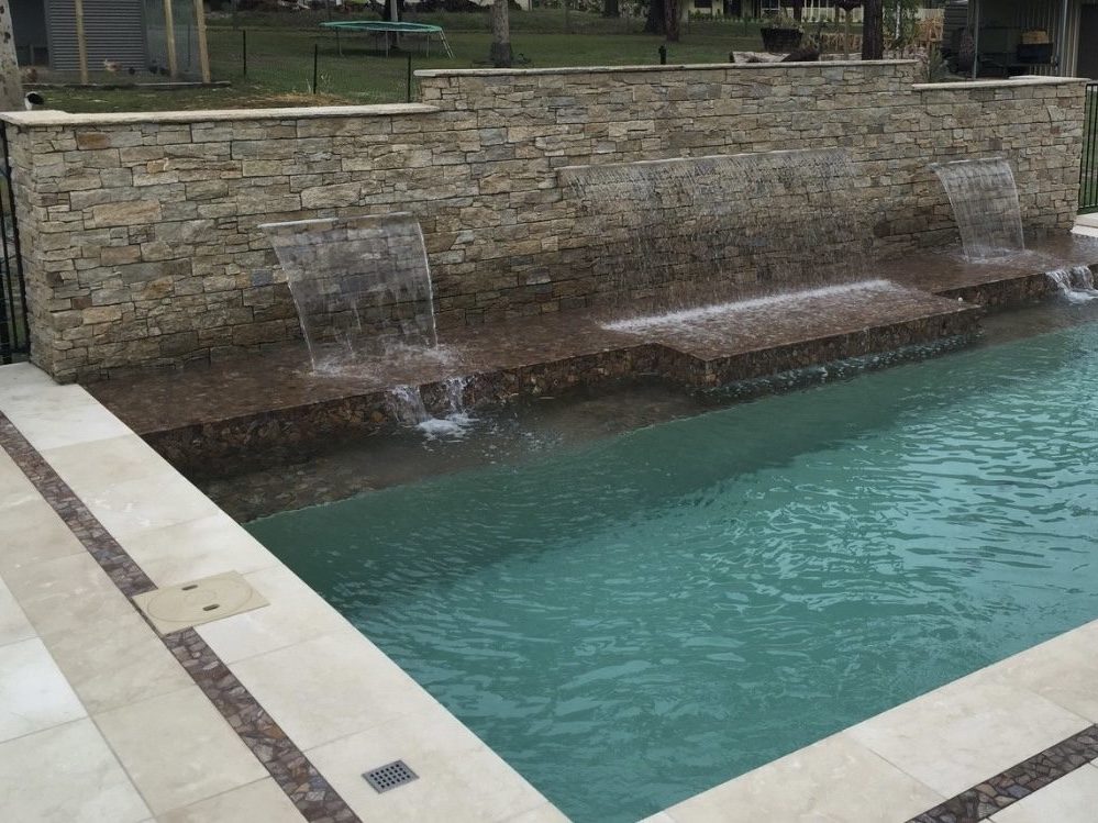 natural stone pavers, outdoor pavers, pool coping, pool surround ideas, pool surrounds, swimming pool tiling, swimming pool paving, paver stones, pool landscaping