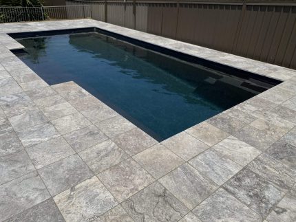 pool surrounds, travertine coping, natural stone for swimming pools, granite pavers, limestone pavers, stone pavers, pool concreting, swimming pool tiling