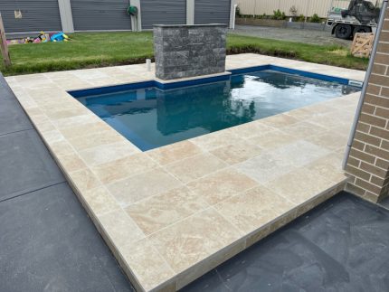 pool surrounds, travertine coping, natural stone for swimming pools, granite pavers, limestone pavers, stone pavers, pool concreting, swimming pool tiling