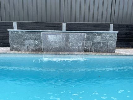 pool surrounds, travertine coping, natural stone for swimming pools, granite pavers, limestone pavers, stone pavers, pool concreting, swimming pool tiling